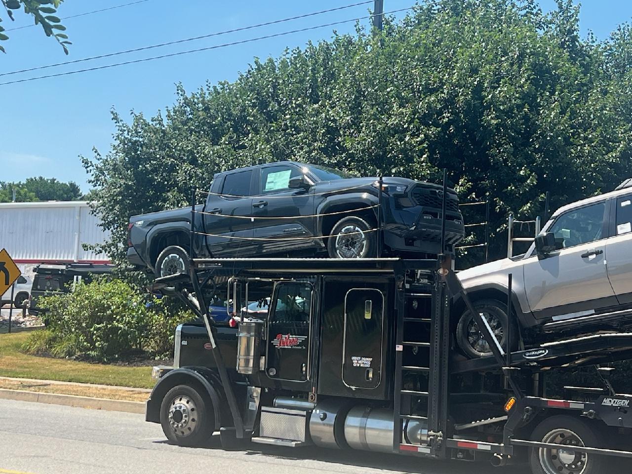 2024 Tacoma [Picture] Which one of y'all will be getting a call from your dealer 🤣 Trailer carrying new Tacomas flips on highway 11584 (1) (1)