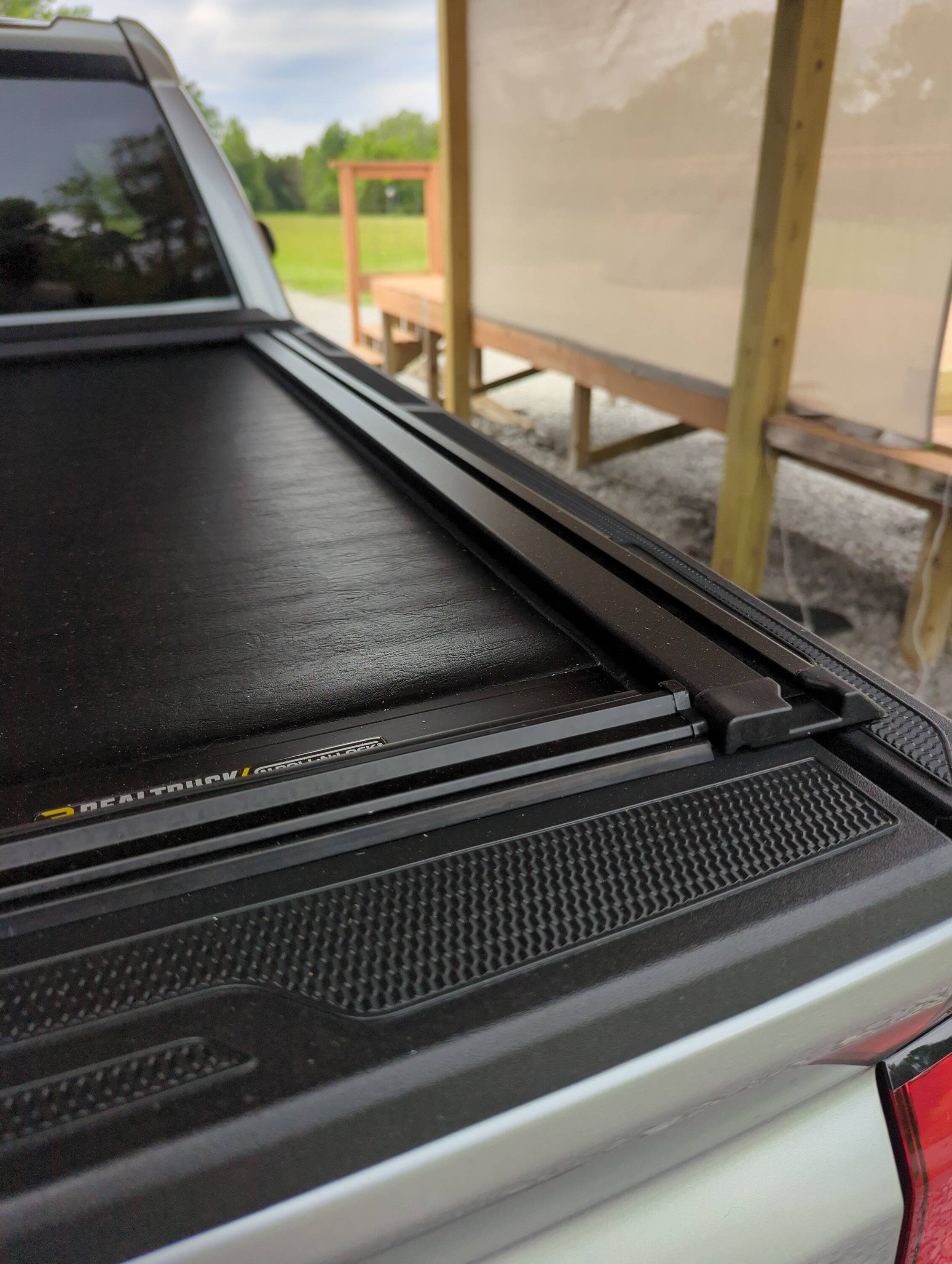 2024 Tacoma Looking for a bed/tonneau cover for the 5ft bed. one that works with my bed rack adapters and that won’t break the bank. What are yall using for cover 2024-05-2208.35.515646493819578273260