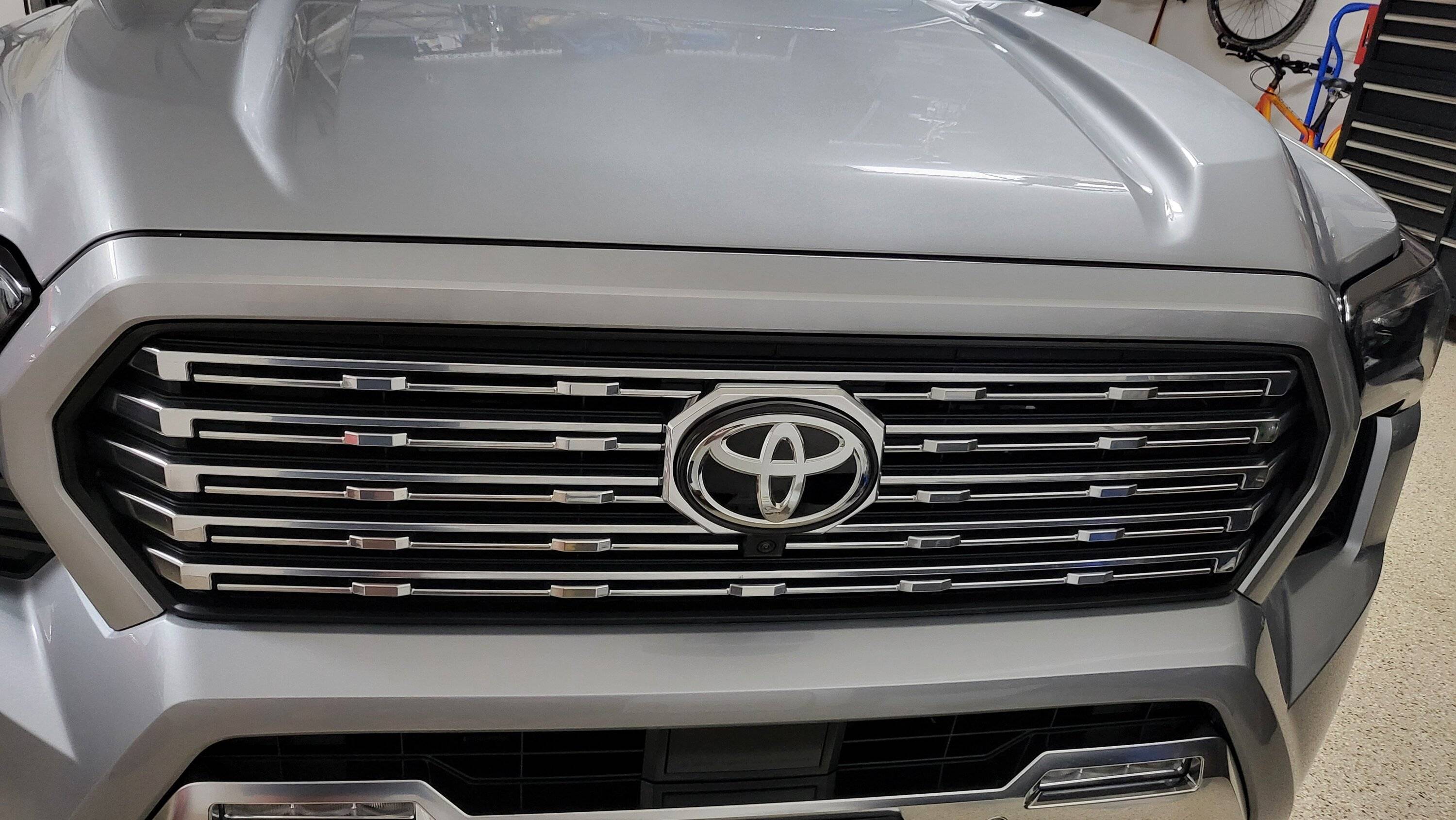 2024 Tacoma Illuminated Front Toyota Emblem (PT413-35240) - anyone install on front grill yet? 20240620_210444