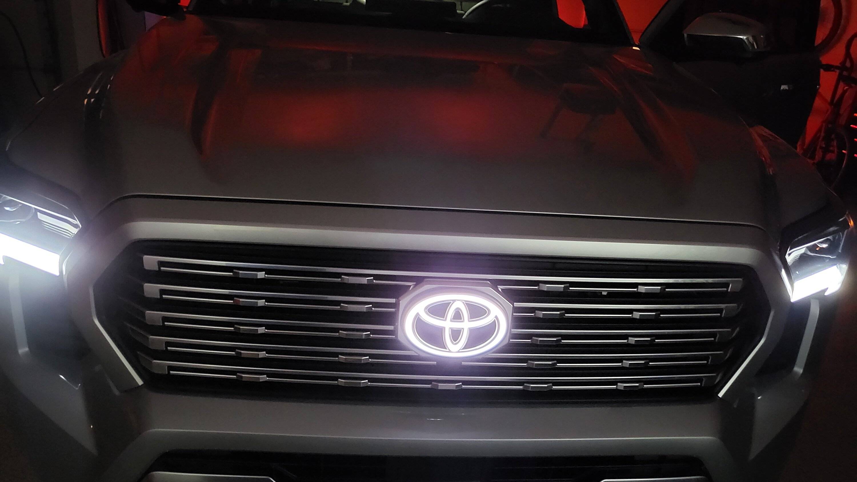 2024 Tacoma Illuminated Front Toyota Emblem (PT413-35240) - anyone install on front grill yet? 20240620_210913