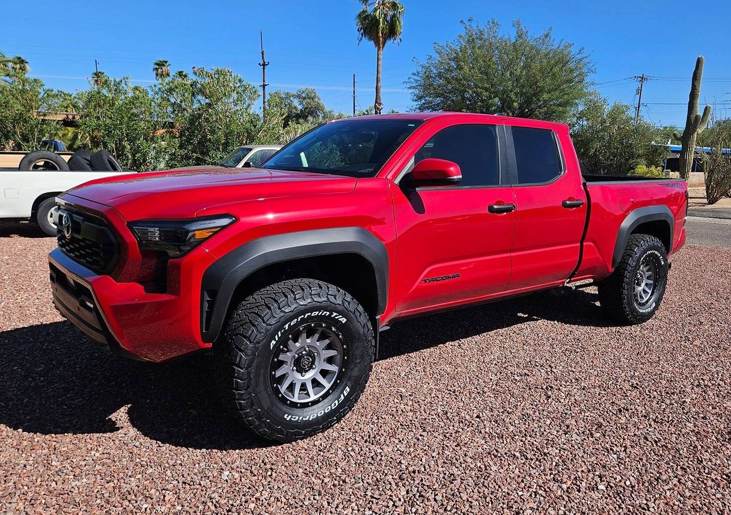 2024 Tacoma Supersonic Red TRD Off-Road on 17" Icon Wheels, BFG KO3 315/70 Tires, Lift Kit 20240920_145252