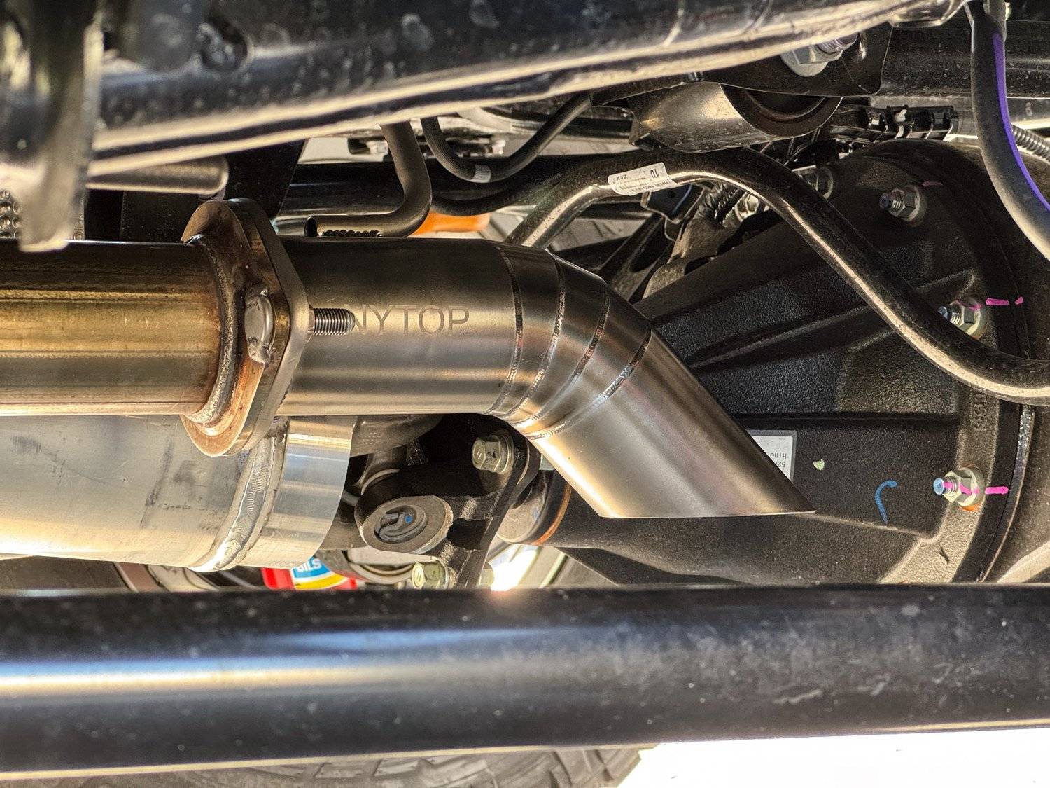 2024 Tacoma Toyota OEM Trailhunter Exhaust Dump installed on TRD Off-Road iForce Gas Non-Hybrid IMG_0733