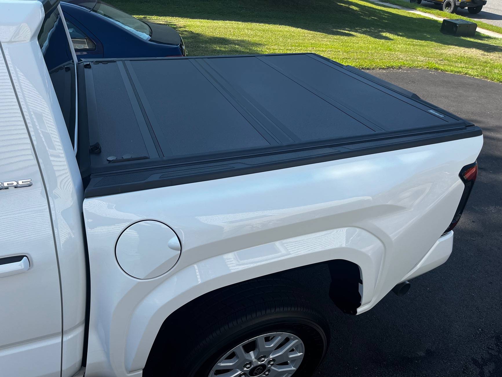 2024 Tacoma Toyota OEM hard bed tonneau cover is NICE. IMG_2522