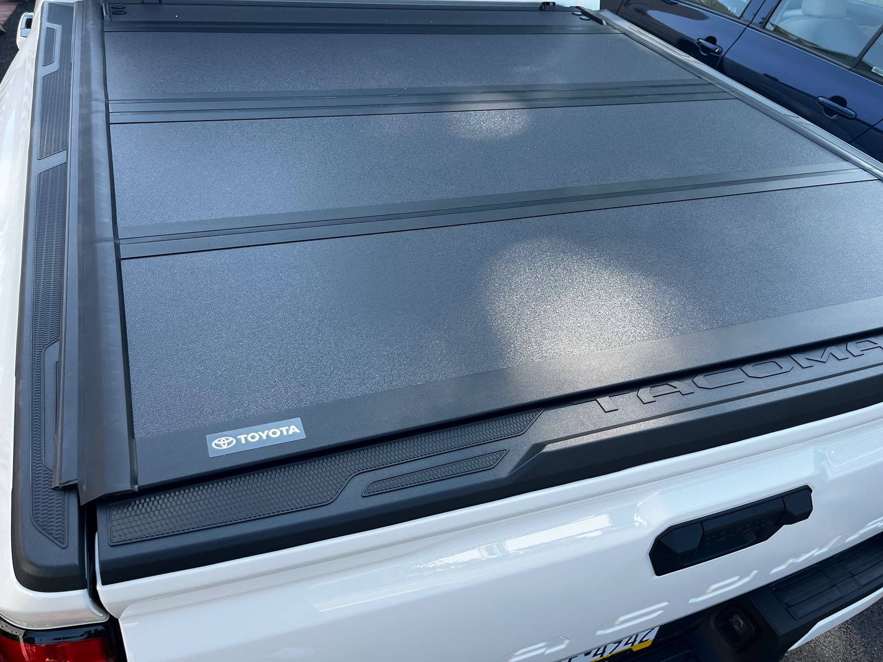 2024 Tacoma Toyota OEM hard bed tonneau cover is NICE. IMG_2523