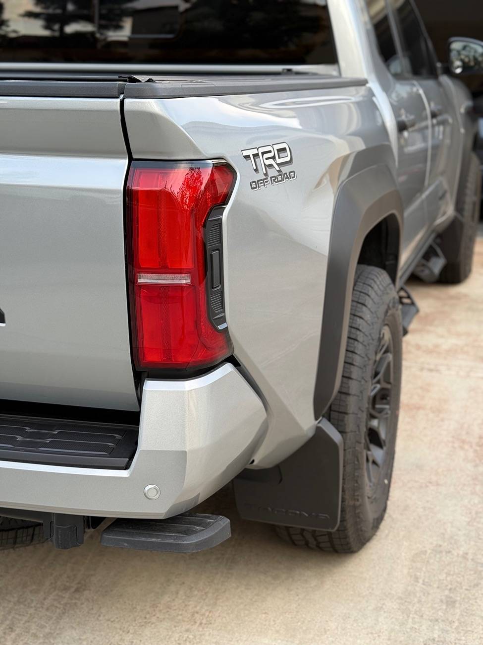 2024 Tacoma OEM mudflaps. Canada vs US. IMG_2780