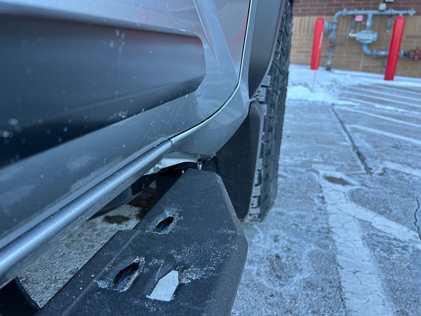 2024 Tacoma OEM mudflaps. Canada vs US. IMG_4582