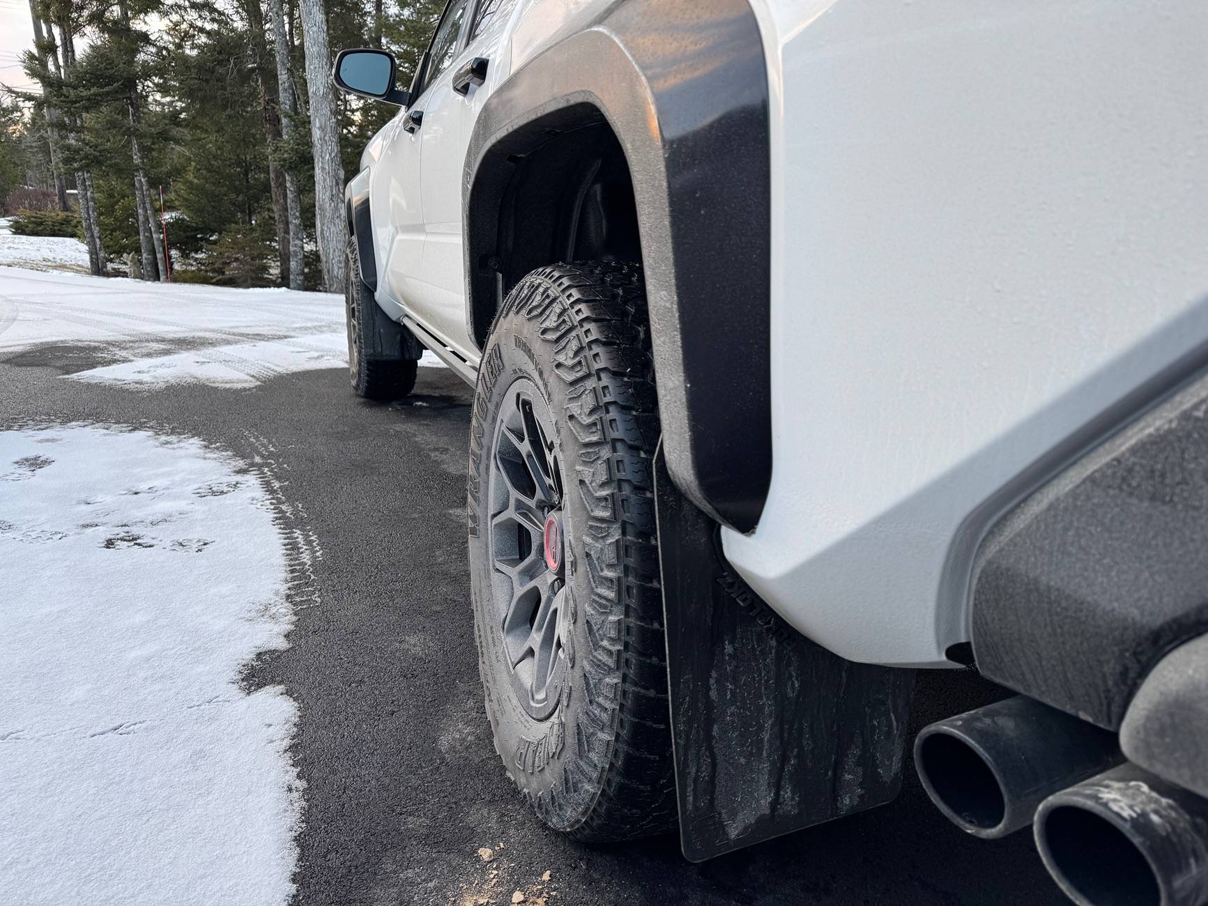 2024 Tacoma OEM mudflaps. Canada vs US. IMG_4637