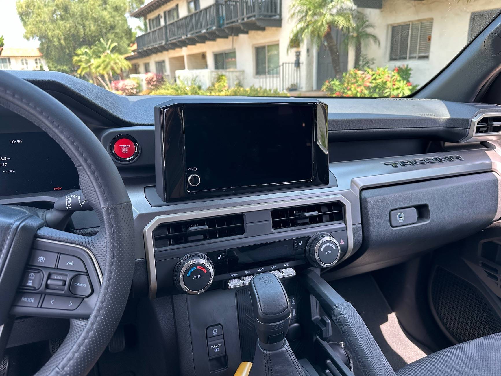 2024 Tacoma 8" inch screen clunky look fix with Tufskinz black gloss screen trim IMG_4719