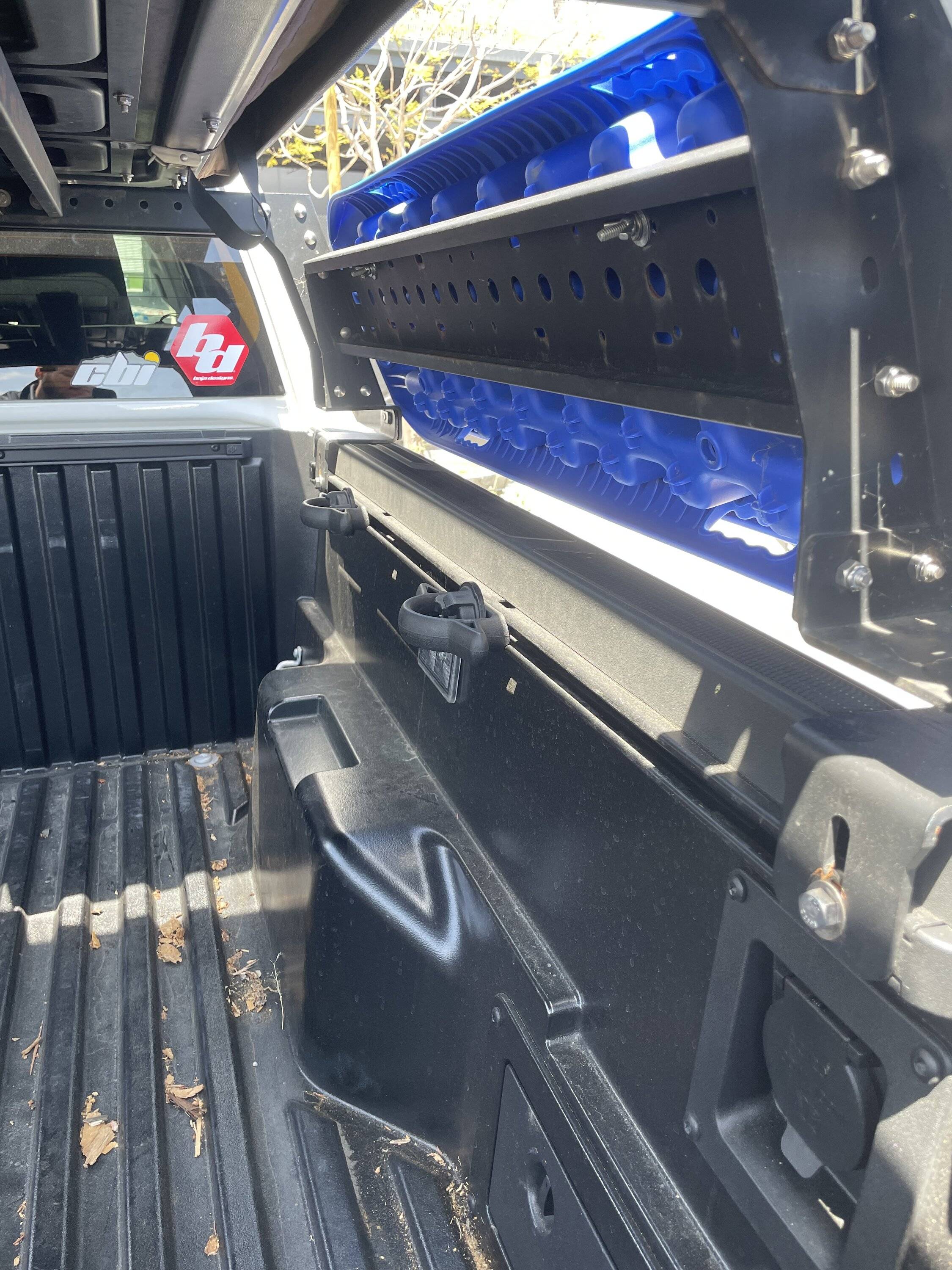 2024 Tacoma Looking for a bed/tonneau cover for the 5ft bed. one that works with my bed rack adapters and that won’t break the bank. What are yall using for cover IMG_8263