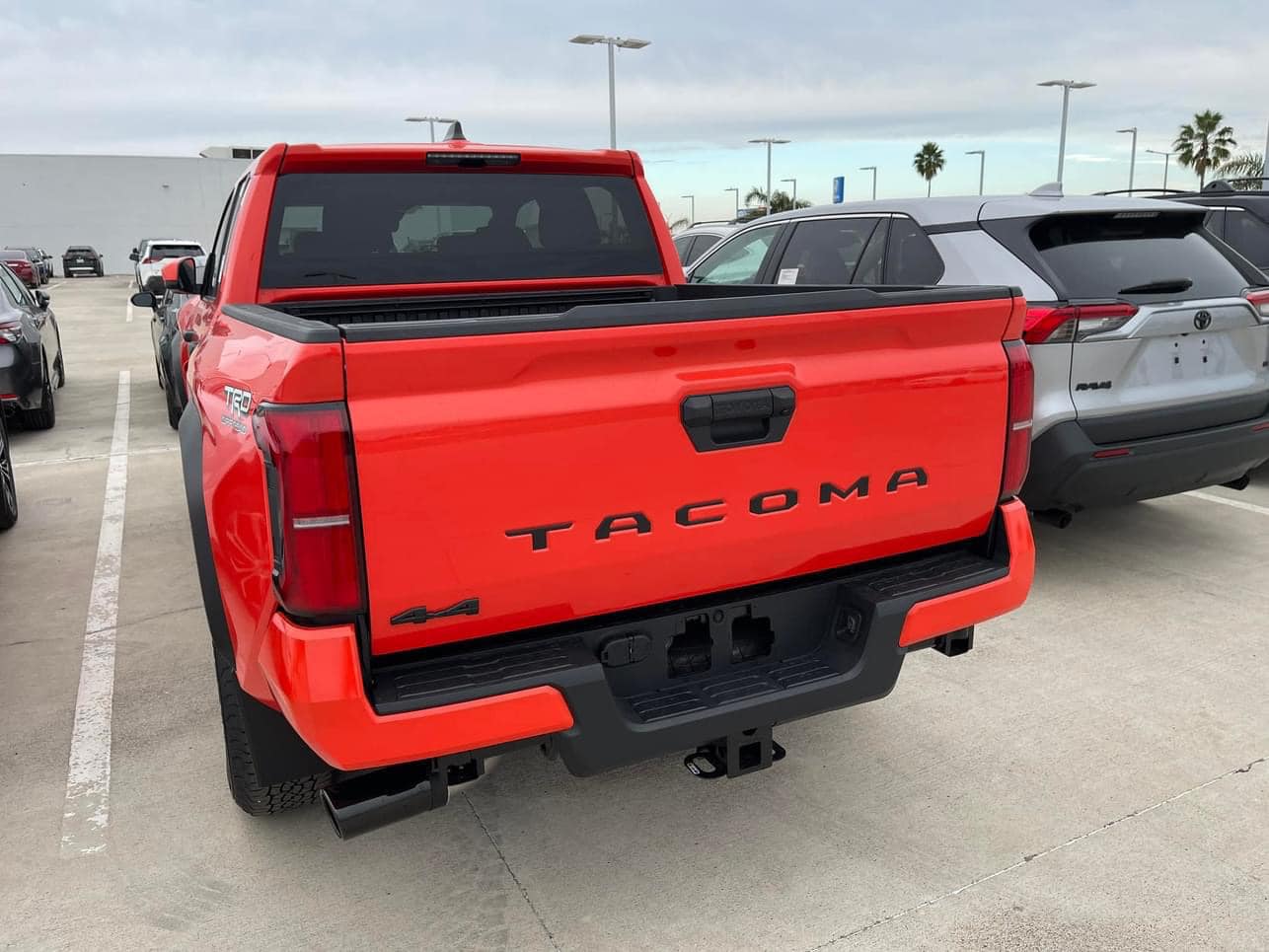 2024 Tacoma Updates of 2024 Tacomas on dealer lots (dealership, pricing, photos) Solar Octane 2024 Tacoma TRD Off-Road interior & exterior at dealership 7