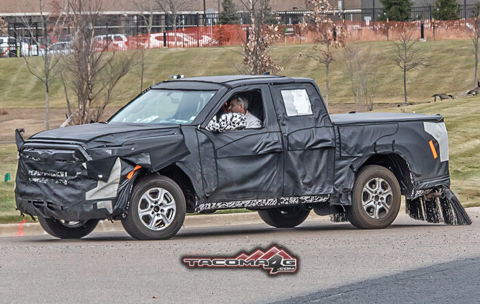 Spied: 2024 Toyota Tacoma Mule Reveals Partial Headlights, Grille and Hybrid Clues